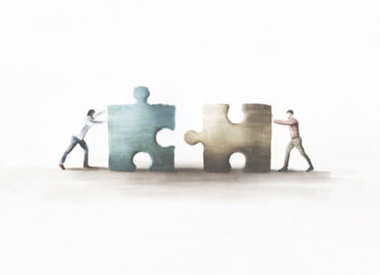 Illustration of people pushing jigsaw pieces together